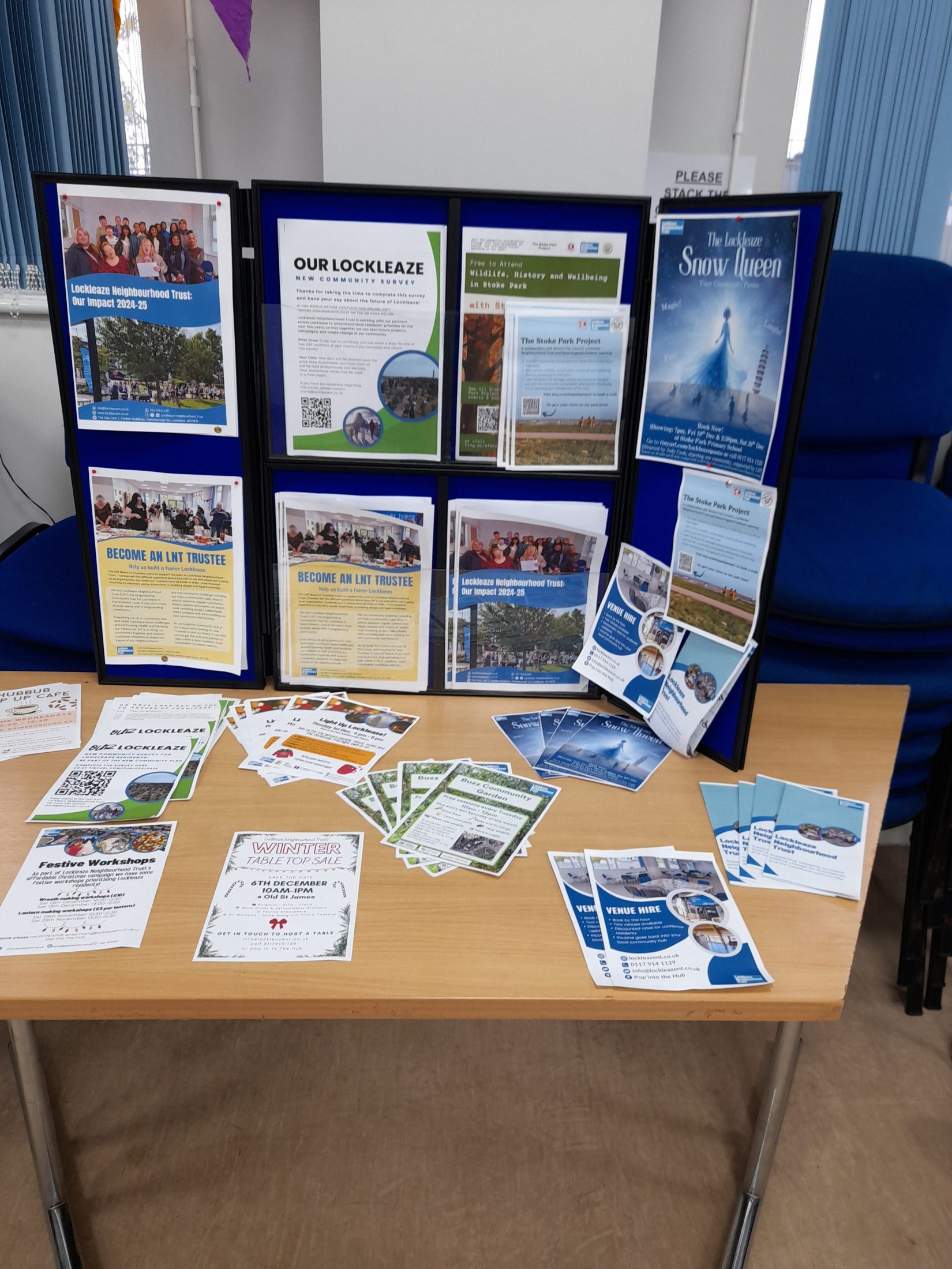 display board with LNT impact report, Our lockleaze community survey, stoke park walks, the snow queen pantomime, info about becoming a trustee and more
