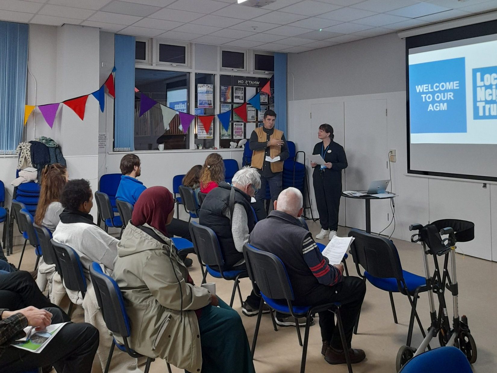 a man and a woman present in front of an audience