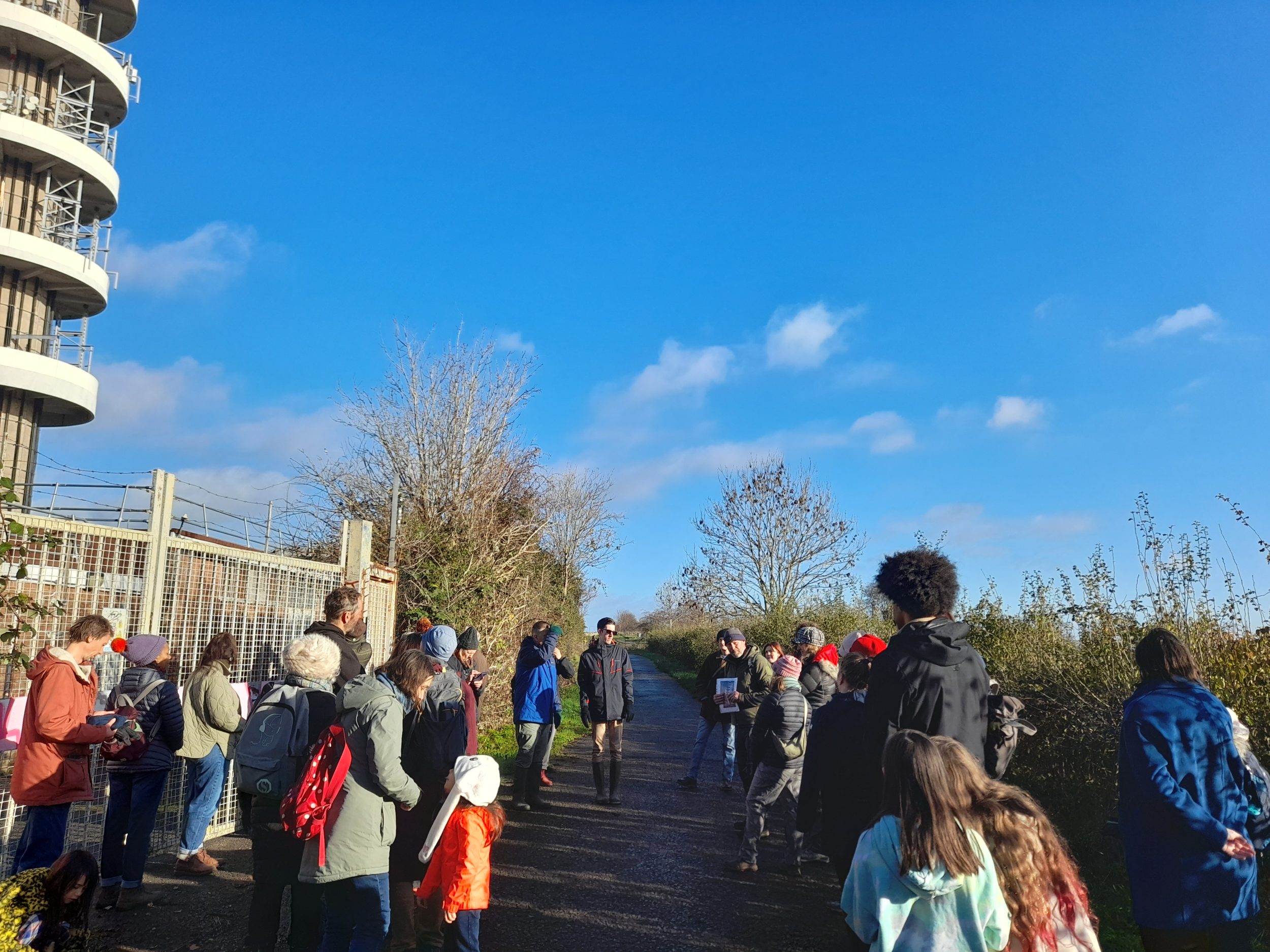 walkers look up at the purdown tower