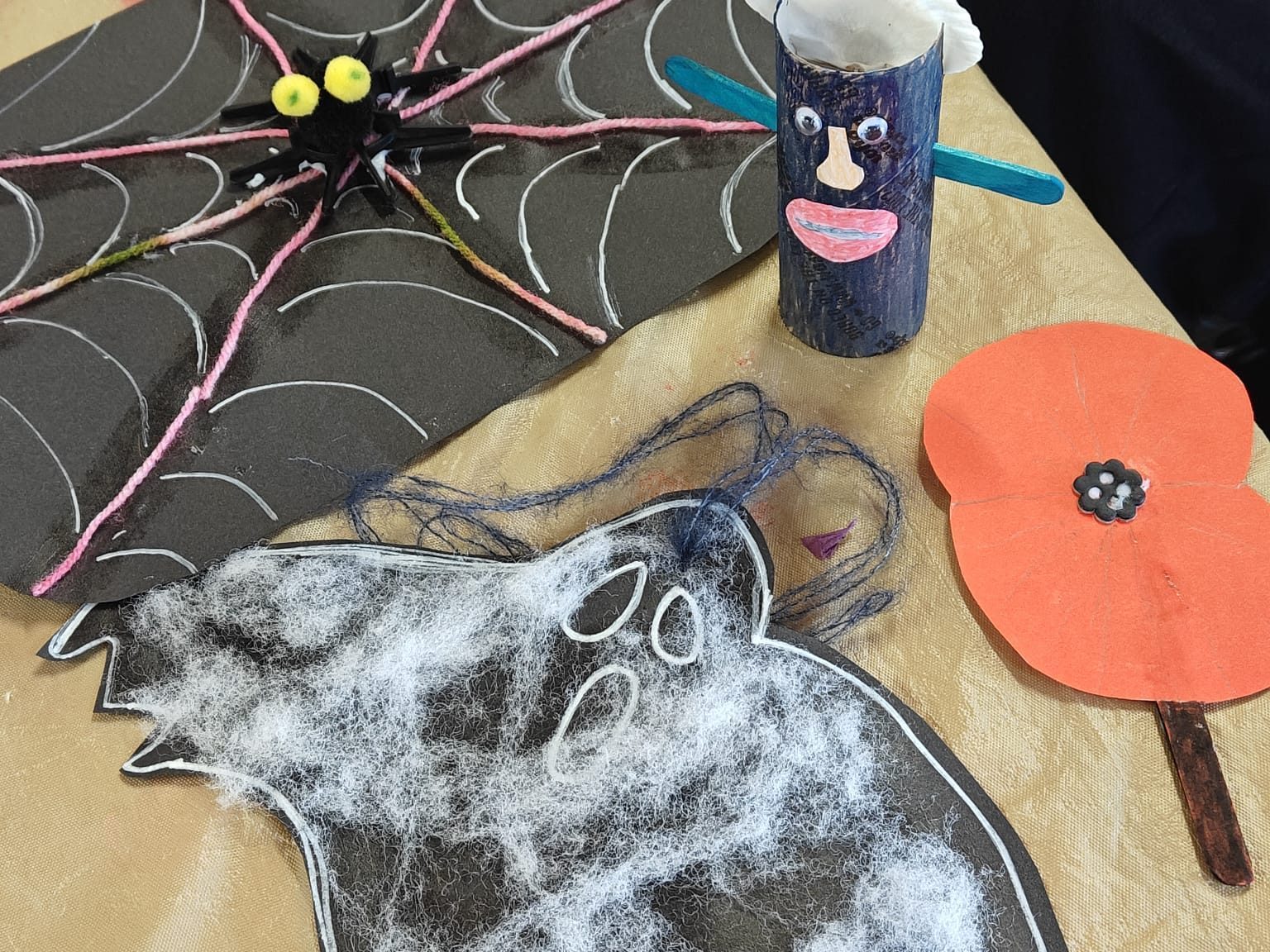 four cardboard halloween themed art pieces